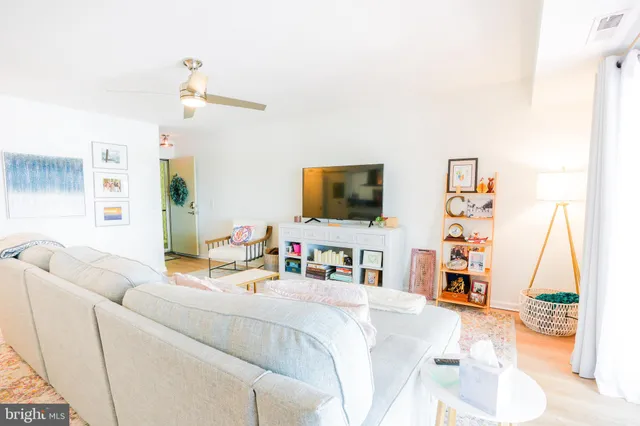 a bedroom with furniture and a flat screen tv