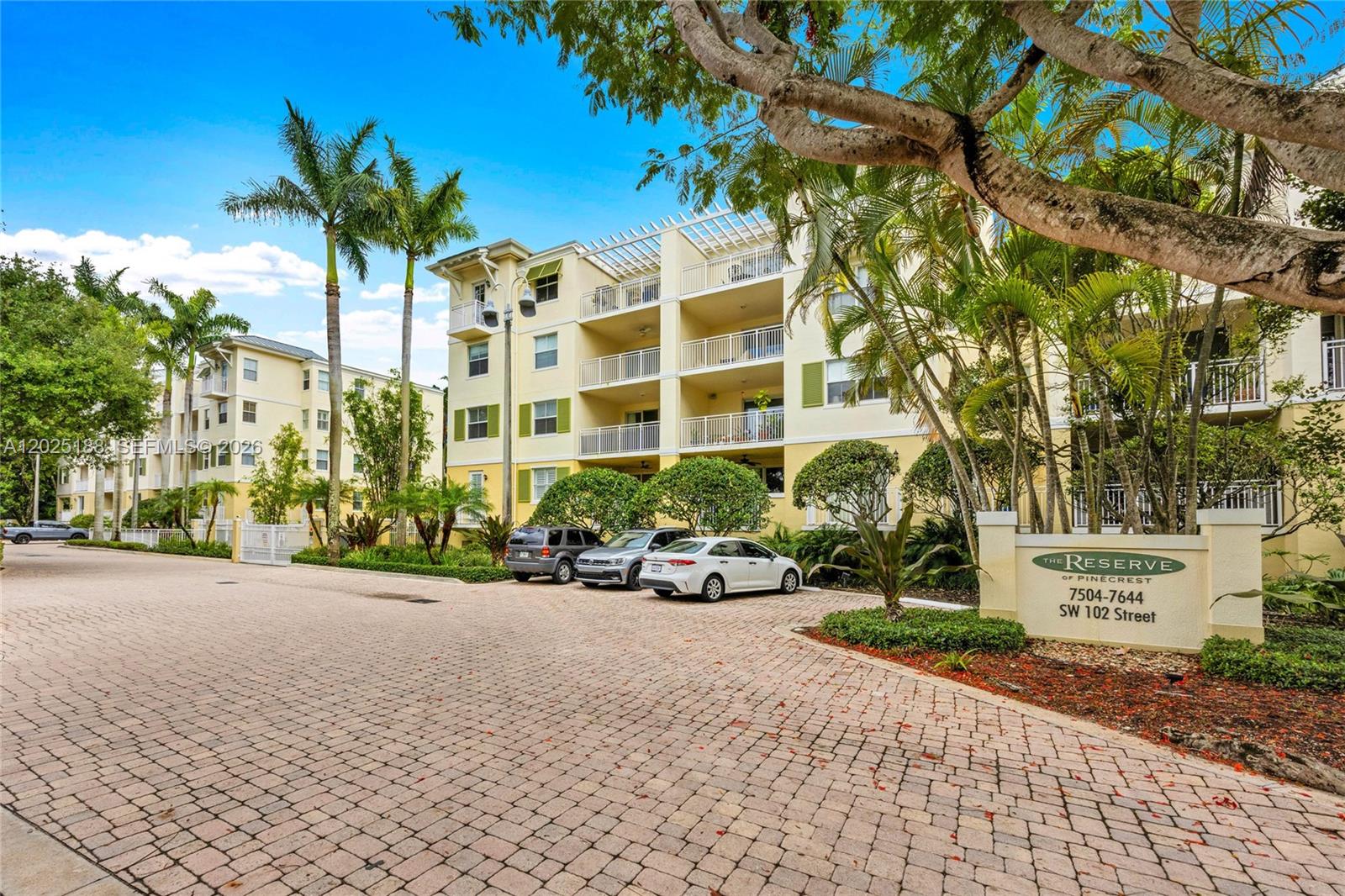 7620 Southwest 102nd Street, Unit 121 Pinecrest, FL 33156 - Photo 18 of 18 a view of a street with a building in the background