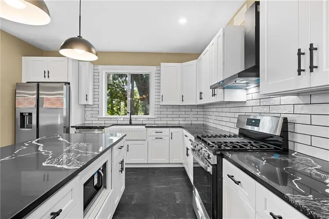 a close view of a sink and a stove in a kitchen