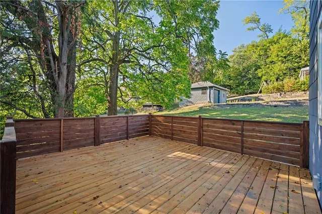 a view of deck with wooden floor and fence