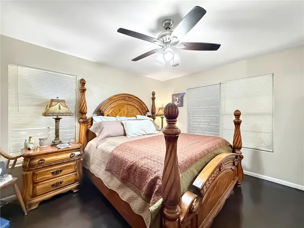 a bedroom with a bed and window