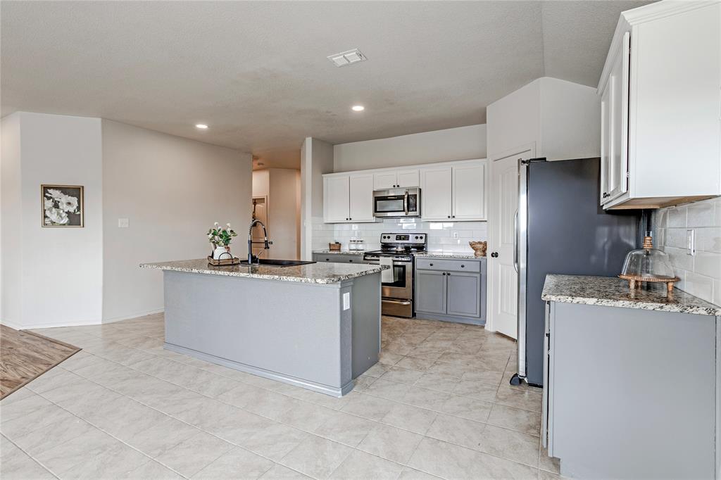 345 Chestnut Lane Ponder, TX 76259 - Photo 16 of 29 a kitchen with cabinets and a sink