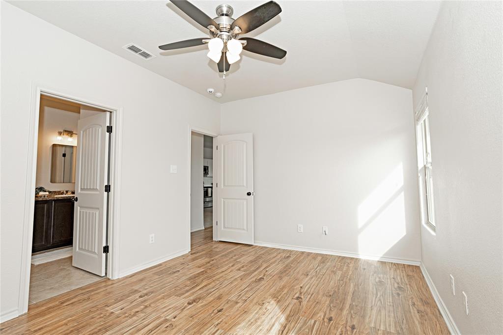 345 Chestnut Lane Ponder, TX 76259 - Photo 22 of 29 a view of a big room with wooden floor closet and chandelier fan