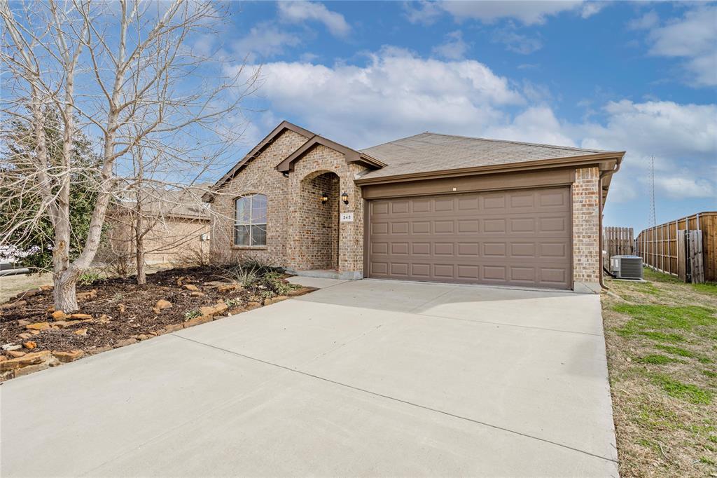 345 Chestnut Lane Ponder, TX 76259 - Photo 3 of 29 a front view of a house with a yard and garage