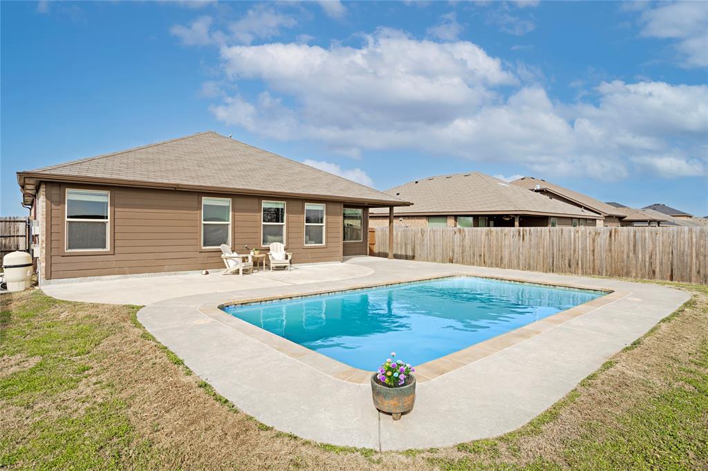 345 Chestnut Lane Ponder, TX 76259 - Photo 4 of 29 a view of a house with swimming pool and wooden fence