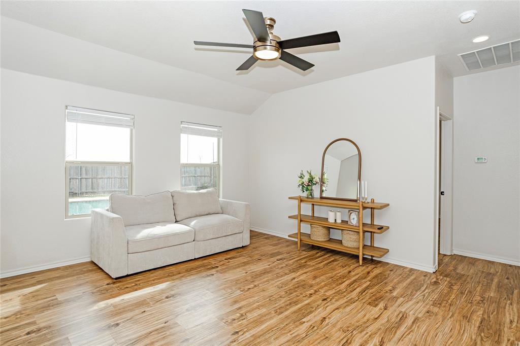 345 Chestnut Lane Ponder, TX 76259 - Photo 6 of 29 a living room with a bed furniture and a window