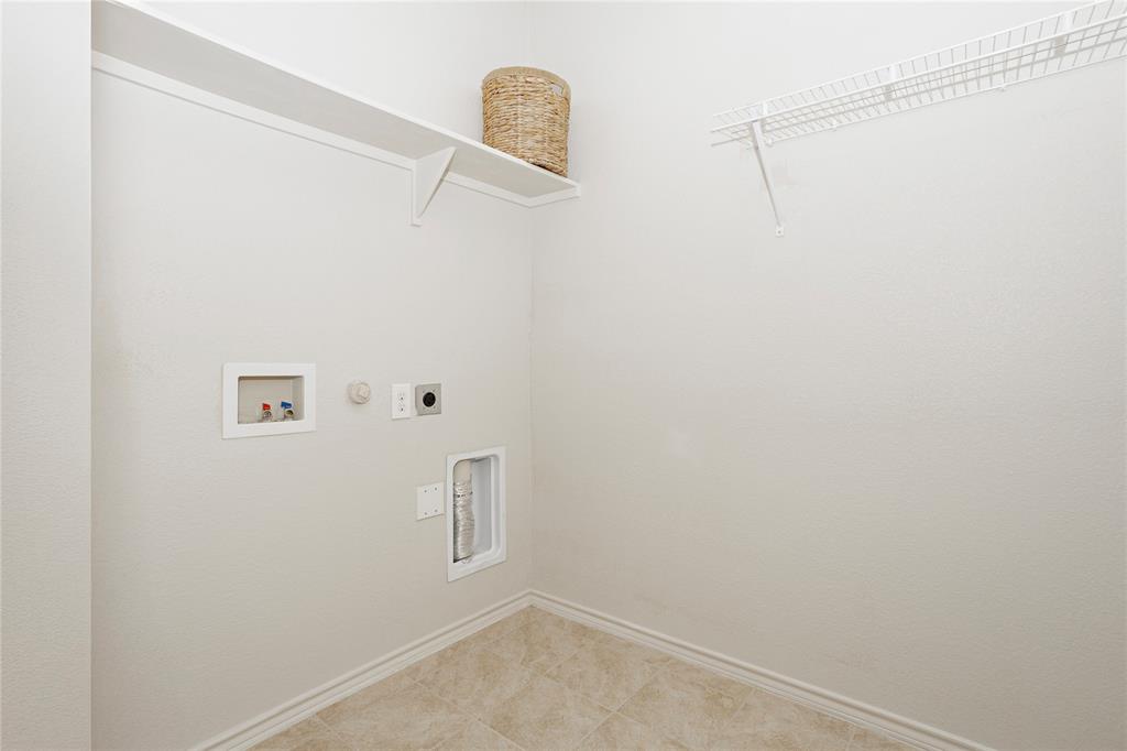 345 Chestnut Lane Ponder, TX 76259 - Photo 9 of 29 a view of a room with racks on the wall