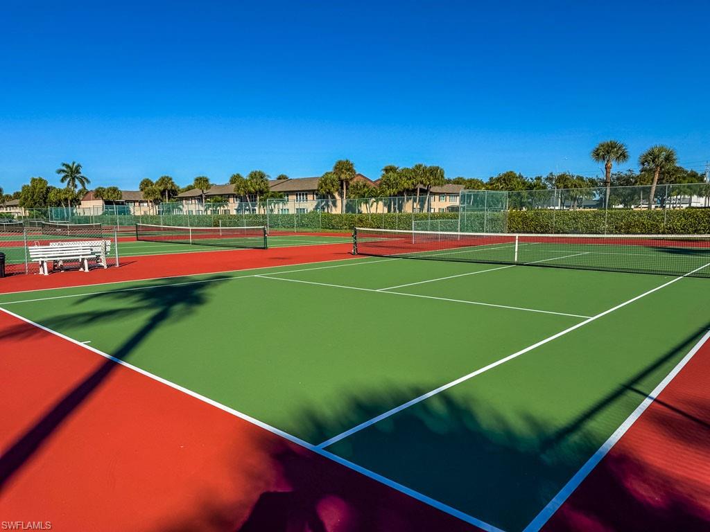 3420 Frosty Way, Unit 4902 Naples, FL 34112 - Photo 27 of 31 a view of an outdoor space and tennis court