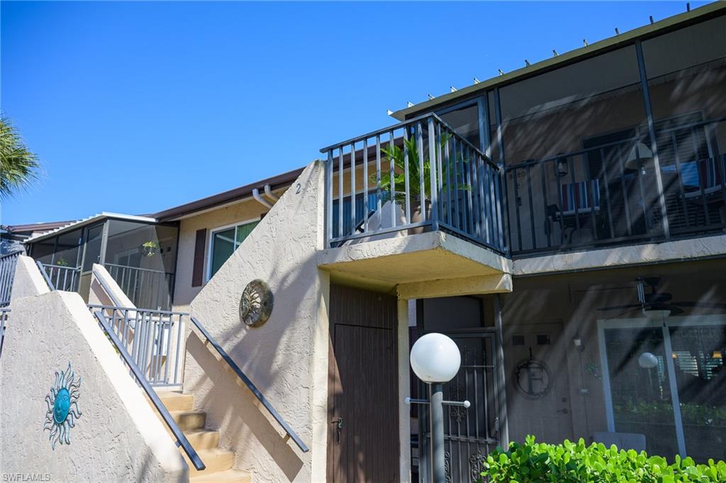 3420 Frosty Way, Unit 4902 Naples, FL 34112 - Photo 3 of 31 a view of a house with wooden fence