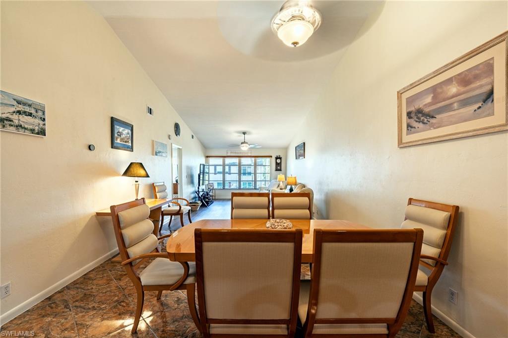 3420 Frosty Way, Unit 4902 Naples, FL 34112 - Photo 6 of 31 a view of a dining room with furniture