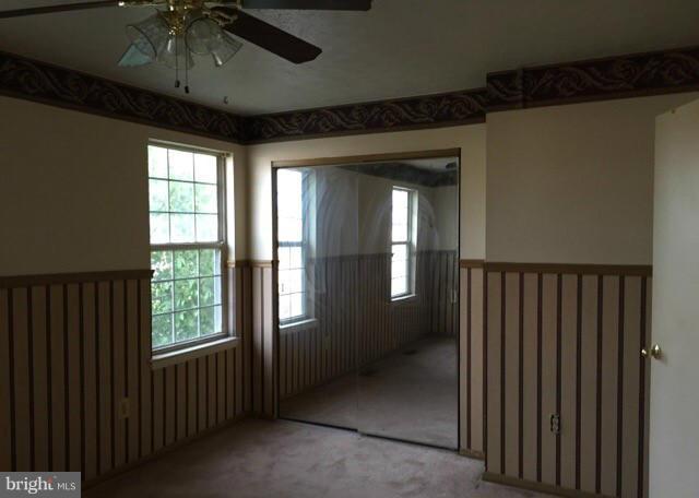 4023 Issacs Road Baltimore, MD 21220 - Photo 8 of 16 wooden floor in an empty room with a window