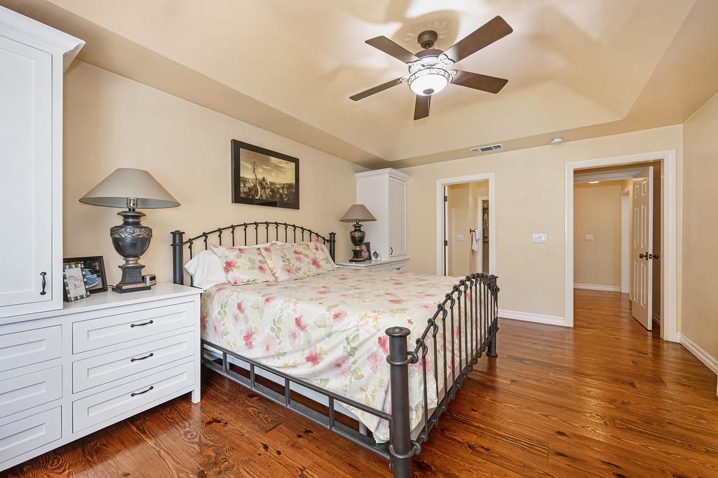 3557 Val Verde Road Loomis, CA 95650 - Photo 28 of 71 a bedroom with a bed and a chandelier