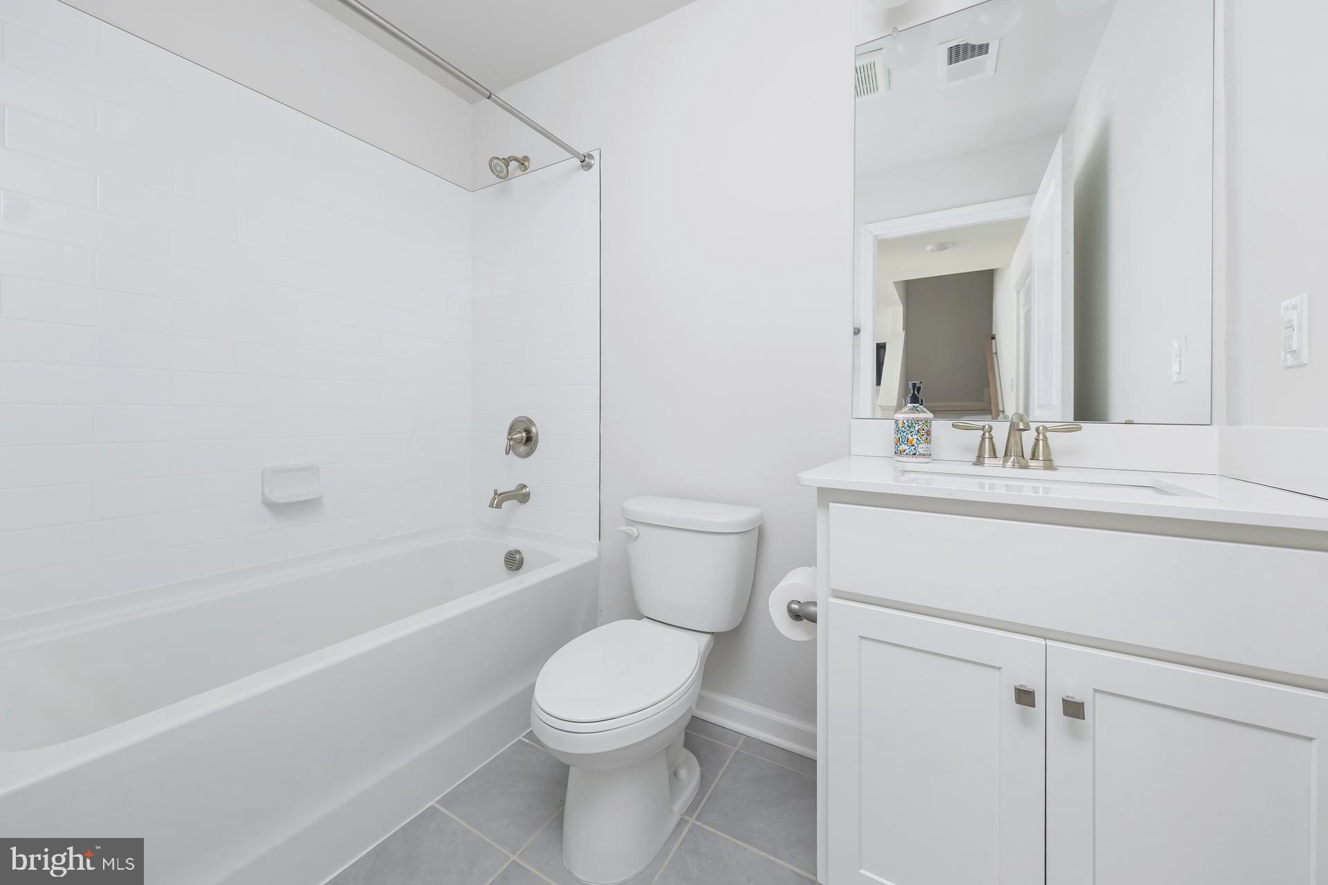 18 Foundry Boulevard Mount Holly, NJ 08060 - Photo 13 of 20 a bathroom with a sink a toilet and shower