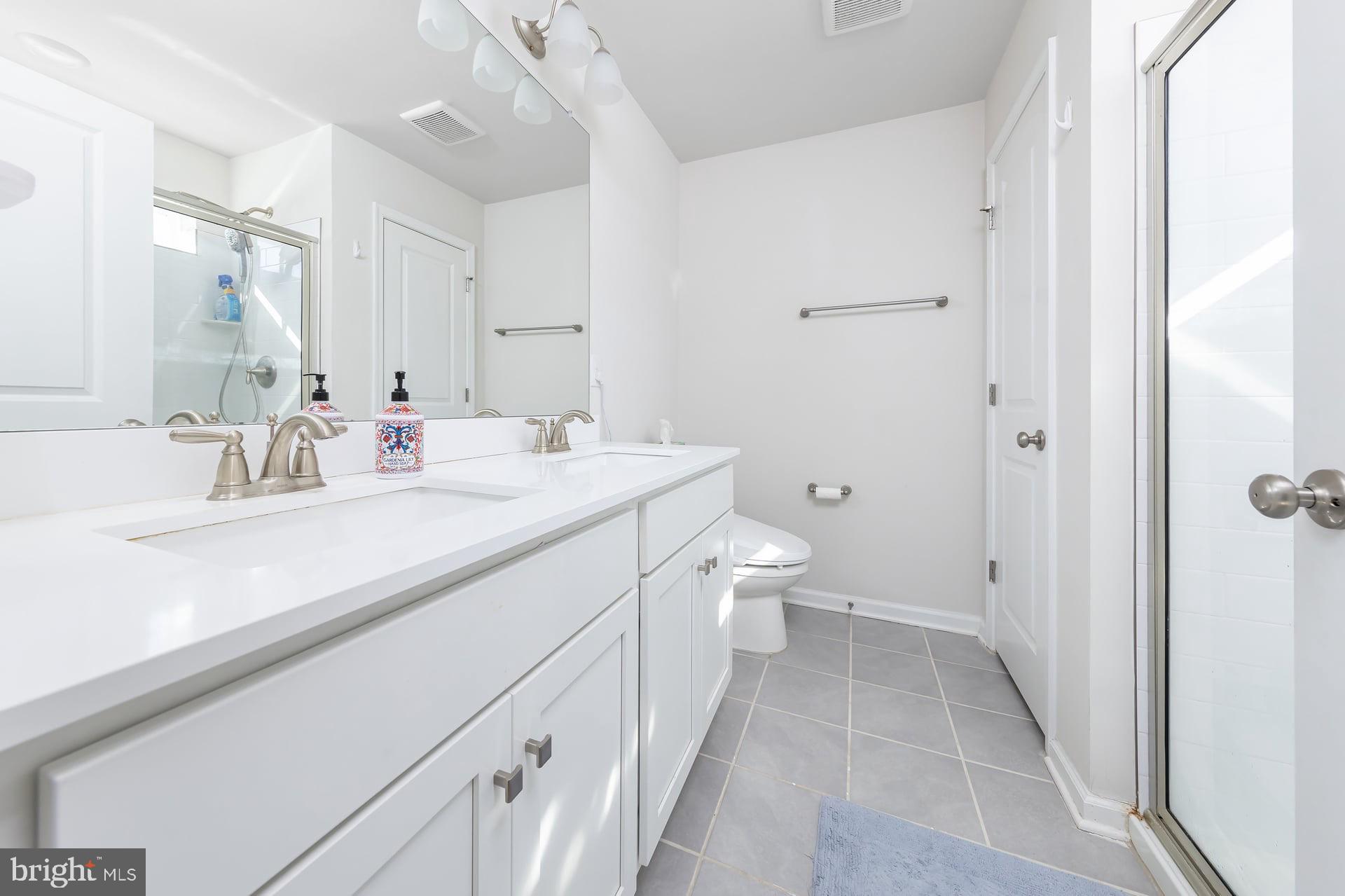 18 Foundry Boulevard Mount Holly, NJ 08060 - Photo 15 of 20 a bathroom with a double vanity sink toilet and shower