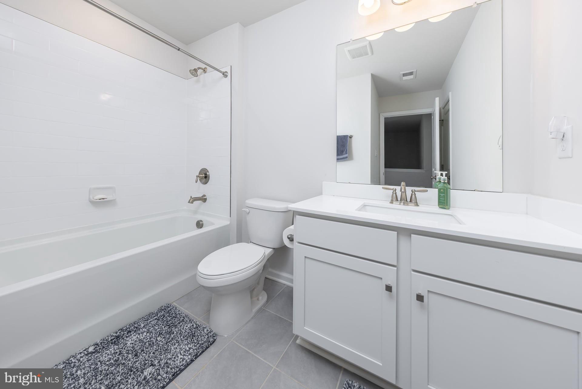 18 Foundry Boulevard Mount Holly, NJ 08060 - Photo 18 of 20 a bathroom with a sink a toilet and shower