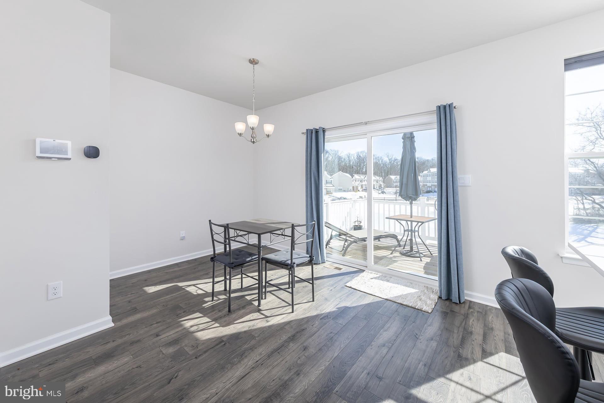 18 Foundry Boulevard Mount Holly, NJ 08060 - Photo 5 of 20 a dining room with wooden floor and large windows