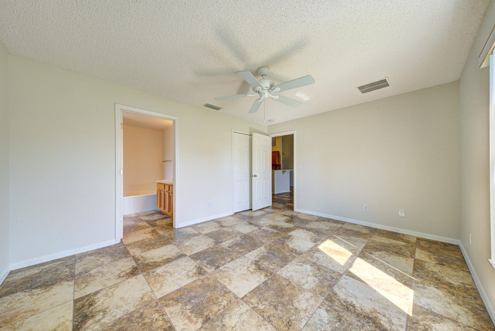 1453 Goyer Road Southeast Palm Bay, FL 32909 - Photo 33 of 41 primary bedroom with ensuite