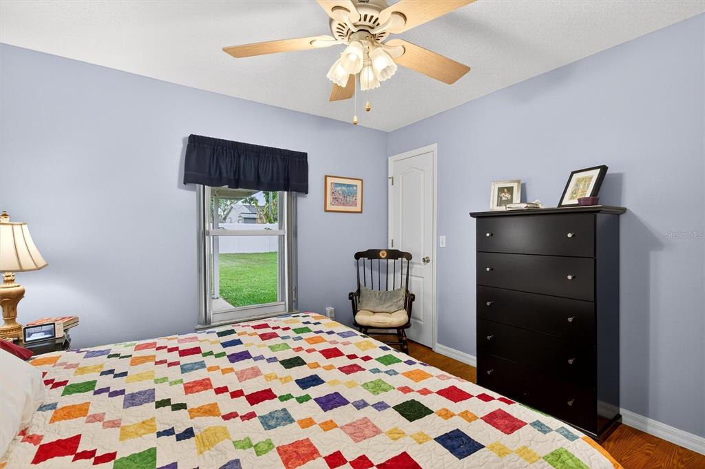 1918 Umbrella Tree Drive Edgewater, FL 32141 - Photo 24 of 44 a bedroom with a bed and a dresser