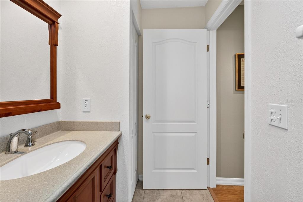 1918 Umbrella Tree Drive Edgewater, FL 32141 - Photo 27 of 44 a bathroom with a sink and a mirror