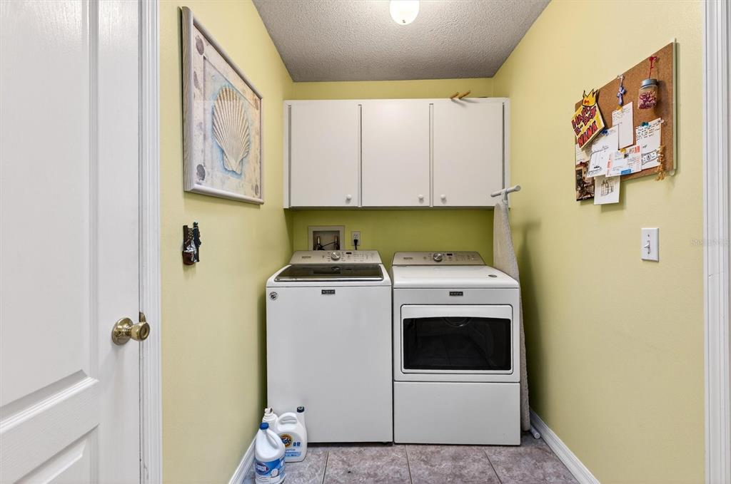 1918 Umbrella Tree Drive Edgewater, FL 32141 - Photo 28 of 44 a utility room with dryer and washer
