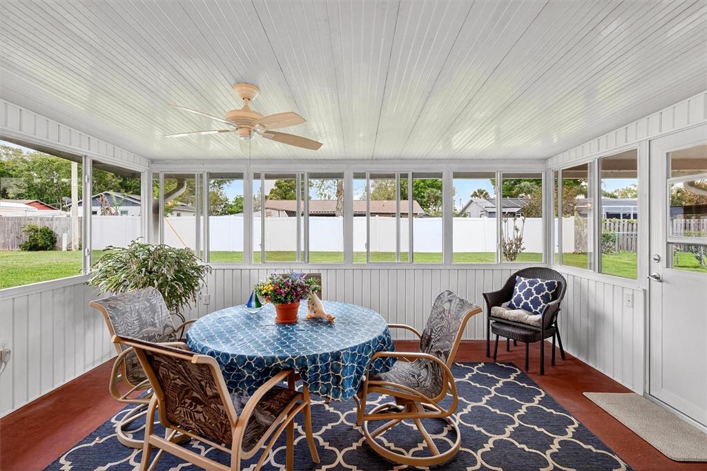 1918 Umbrella Tree Drive Edgewater, FL 32141 - Photo 29 of 44 a outdoor dining space with furniture and outdoor view