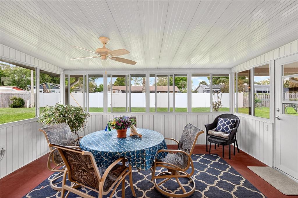 1918 Umbrella Tree Drive Edgewater, FL 32141 - Photo 30 of 44 a outdoor dining space with furniture and outdoor view