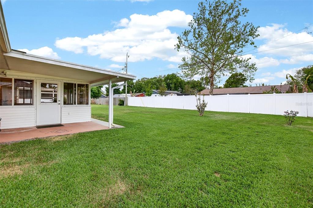 1918 Umbrella Tree Drive Edgewater, FL 32141 - Photo 32 of 44 a view of a house with a backyard