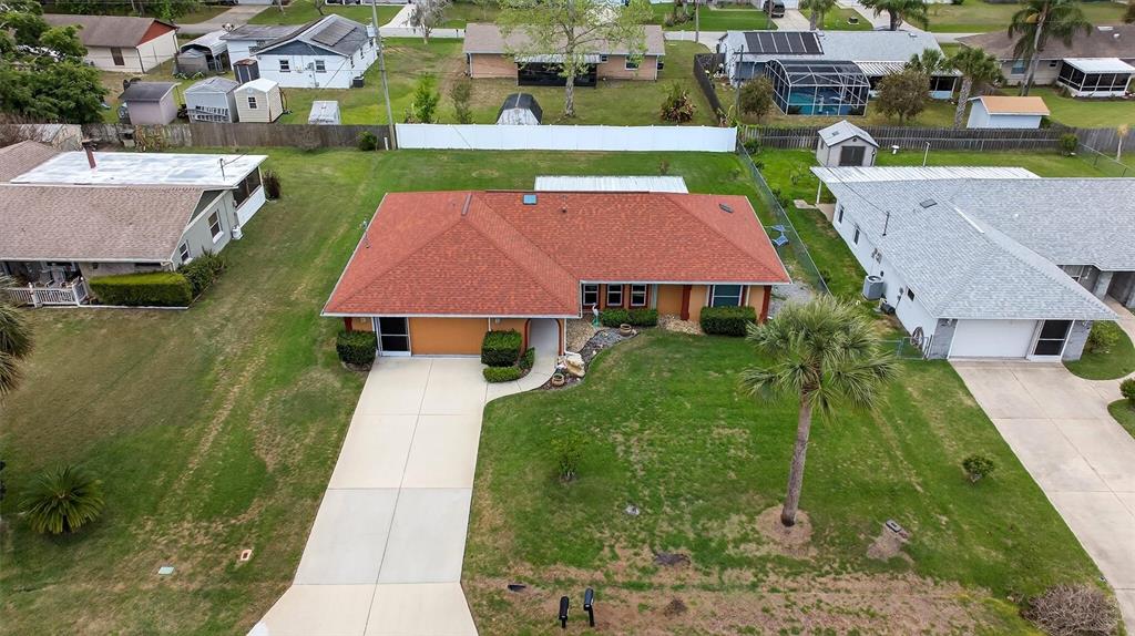 1918 Umbrella Tree Drive Edgewater, FL 32141 - Photo 35 of 44 an aerial view of multiple houses with yard