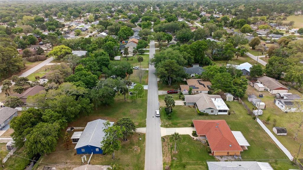 1918 Umbrella Tree Drive Edgewater, FL 32141 - Photo 37 of 44 an aerial view of residential houses with outdoor space and lake view