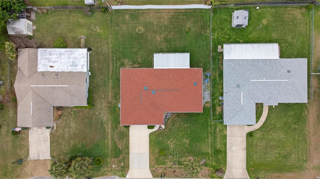 1918 Umbrella Tree Drive Edgewater, FL 32141 - Photo 40 of 44 an aerial view of a house with a yard basket ball court and outdoor seating