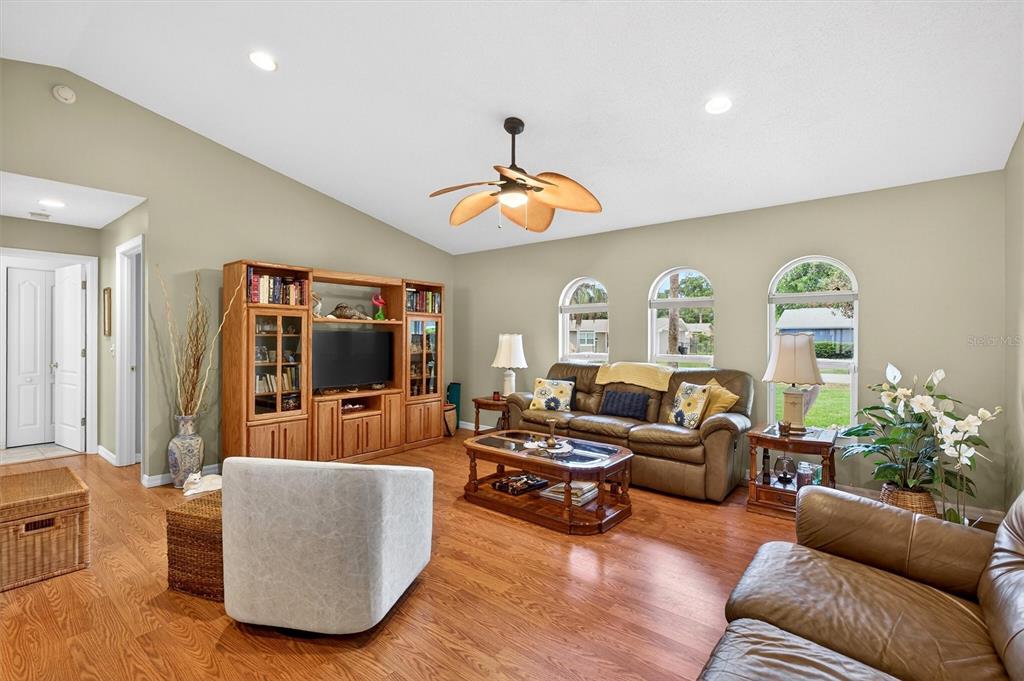 1918 Umbrella Tree Drive Edgewater, FL 32141 - Photo 4 of 44 a living room with furniture and a flat screen tv