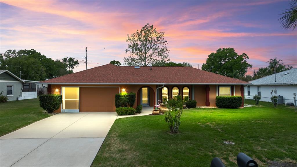 1918 Umbrella Tree Drive Edgewater, FL 32141 - Photo 44 of 44 a view of house with a yard
