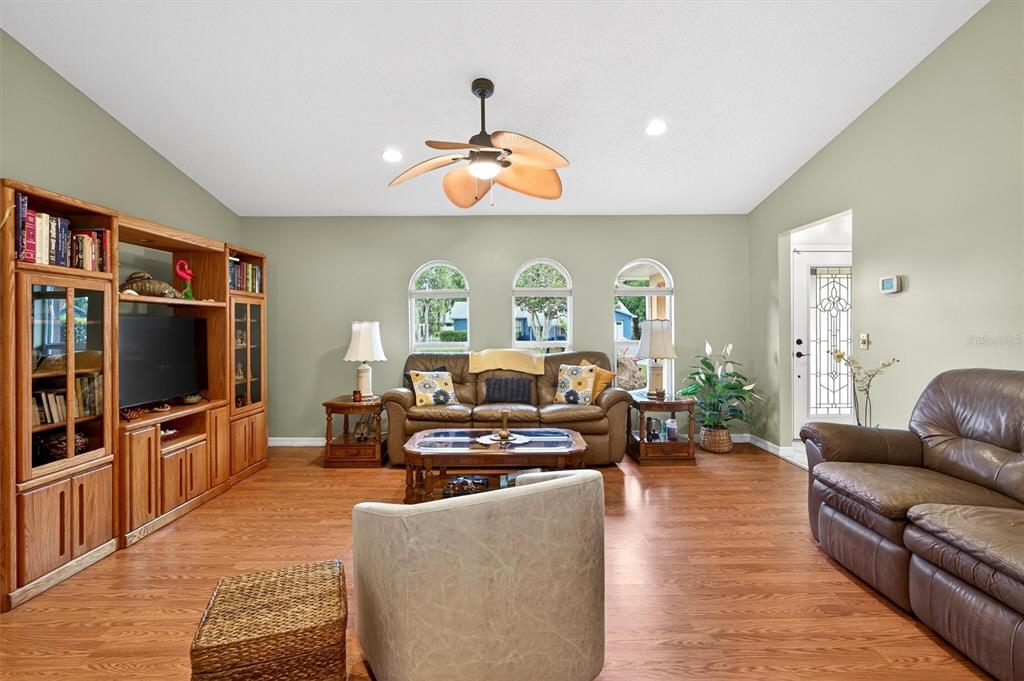 1918 Umbrella Tree Drive Edgewater, FL 32141 - Photo 5 of 44 a living room with furniture and a flat screen tv