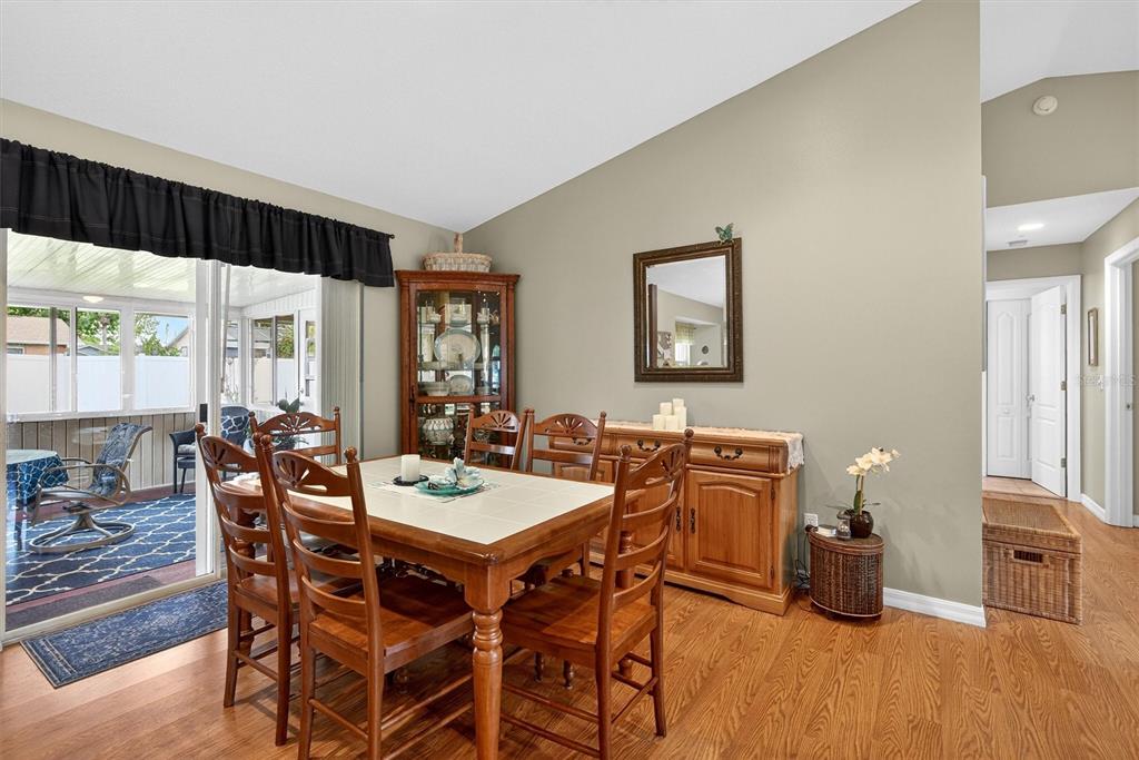 1918 Umbrella Tree Drive Edgewater, FL 32141 - Photo 7 of 44 a dining room with furniture window and wooden floor
