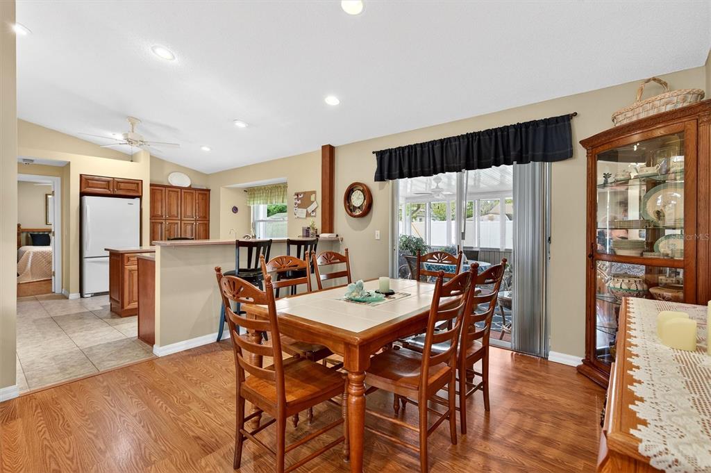 1918 Umbrella Tree Drive Edgewater, FL 32141 - Photo 8 of 44 a view of a dining room with furniture window and wooden floor