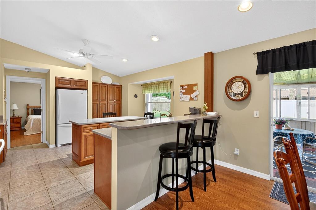 1918 Umbrella Tree Drive Edgewater, FL 32141 - Photo 9 of 44 a living room with stainless steel appliances furniture a clock and a view of kitchen