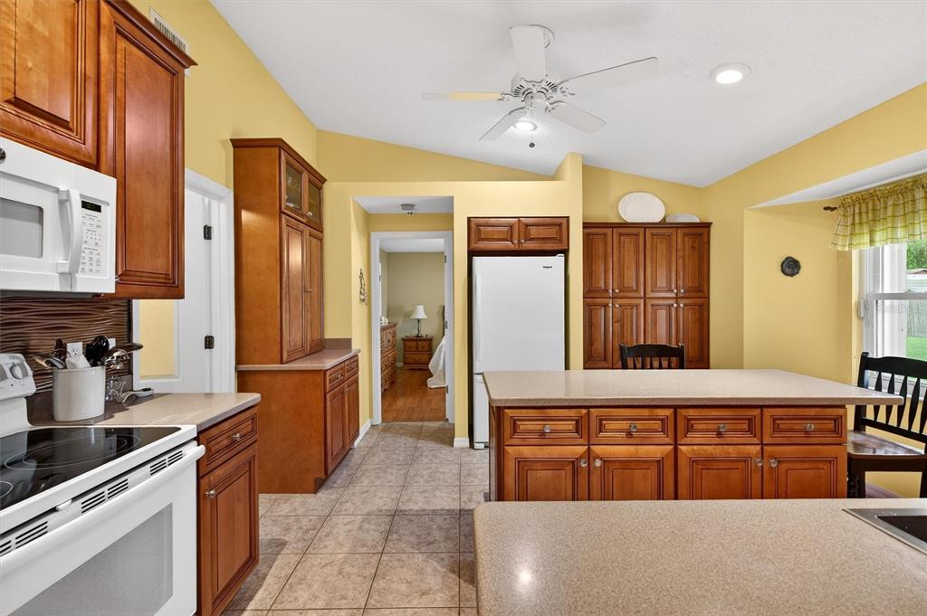 1918 Umbrella Tree Drive Edgewater, FL 32141 - Photo 10 of 44 a bathroom with a double vanity sink a mirror a bathtub and shower