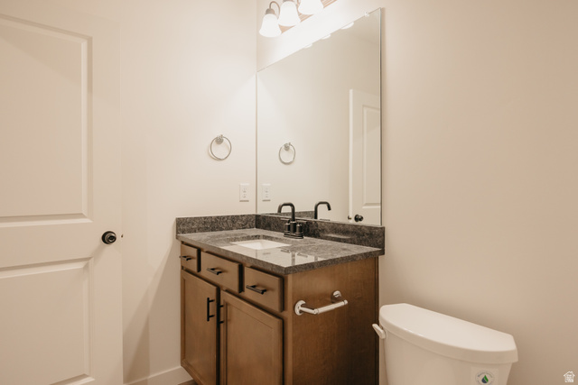 4595 North Fallow Way, Unit 511 Eagle Mountain, UT 84005 - Photo 31 of 32 Half bath featuring toilet and vanity