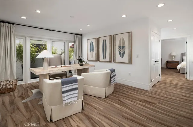 a living room with furniture and large window