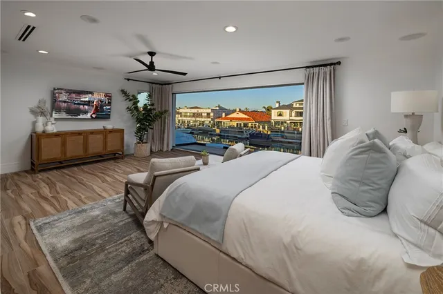 a bed room with a bed and a television