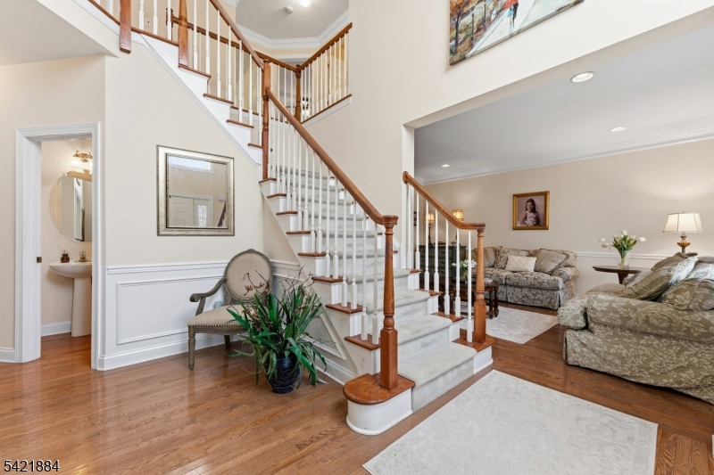 26 Rouser Way Hillsborough, NJ 08844 - Photo 5 of 49 a living room with wooden floor and a potted plant