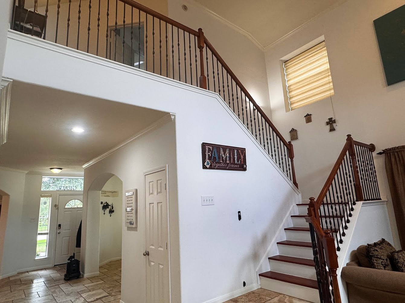 1018 Spring Lakes Haven Spring, TX 77373 - Photo 11 of 31 a view of staircase with lots of frames on wall and a window