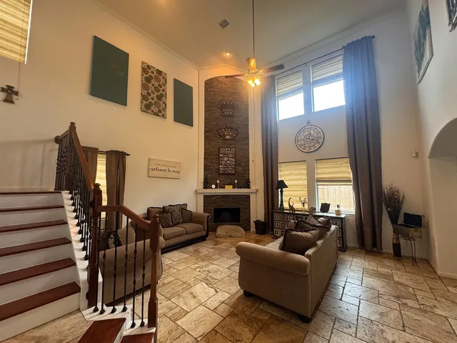a living room with furniture window and wooden floor