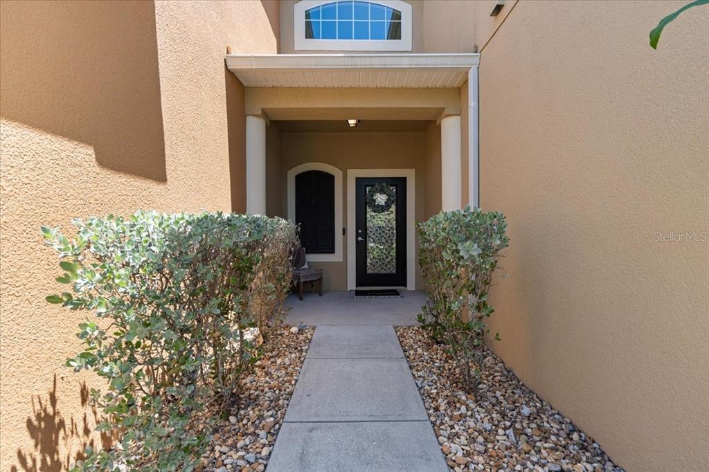 3271 Titanic Circle, Unit 39 Indialantic, FL 32903 - Photo 4 of 60 a entryway with a flower pot