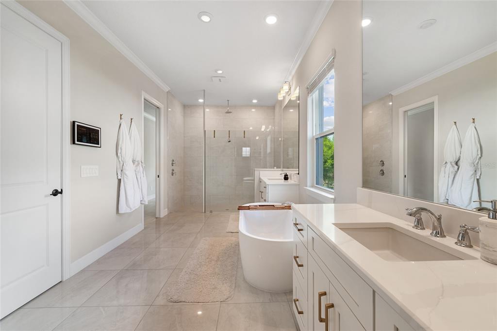 10175 Brocksport Circle Gotha, FL 34734 - Photo 21 of 54 a bathroom with a granite countertop sink a toilet a mirror and shower