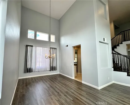 a view of staircase with white walls and a window