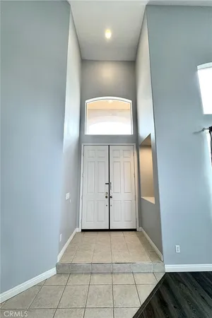 a large kitchen with cabinets and stainless steel appliances