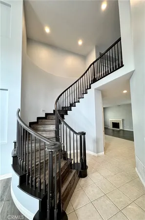 a view of a kitchen with furniture and an empty room