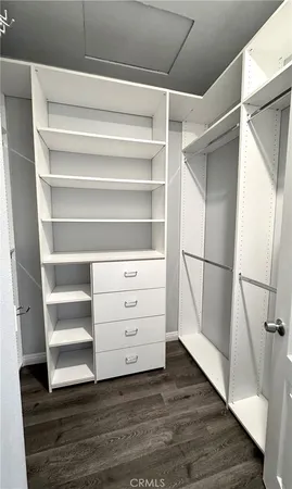 a spacious bathroom with a double vanity sink and a mirror