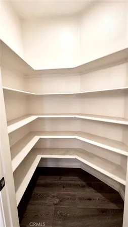 a front view of multi story residential apartment building with yard and sign board